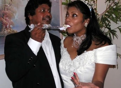 Arnim Ramdass and Donna Campbell Feeding Wedding Cake to Each Other