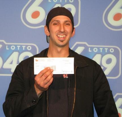 Canada Lotto 6/49 Winner Jason Rinaldi with Cheque