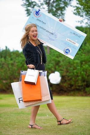 EuroMillions Winner Jane Park with Shopping Bags and Big Cheque