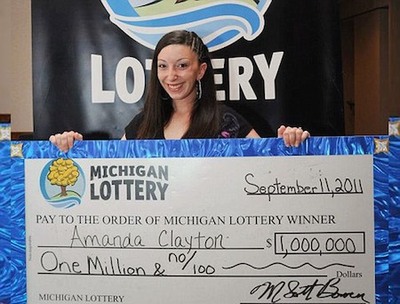 Lottery Winner Amanda Clayton Holding Oversized Cheque