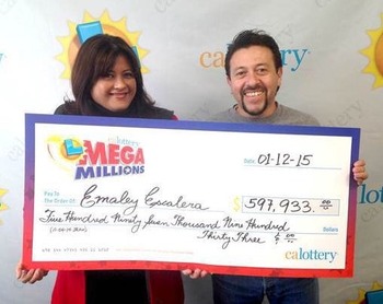 Mega Millions Winners Emaley and Alex Escalera Holding Oversized Check