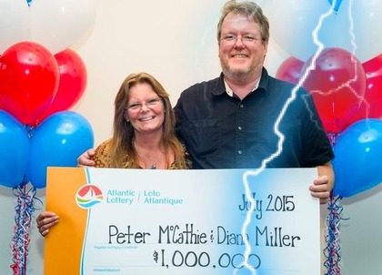 Peter McCathie and Diane Miller Holding Oversized Cheque