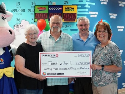 Powerball Winner Thomas Cook with Friend Joe Feeney and Wives Holding Oversized Cheque