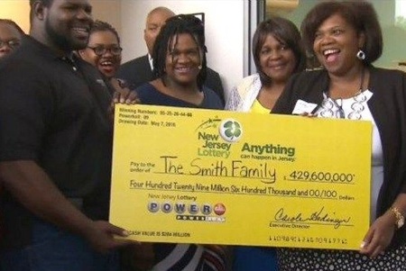 Powerball Winners Pearlie Mae Smith Family Holding Oversized Cheque for $429.6 Million