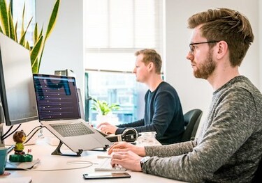 Two Men Working on Computers