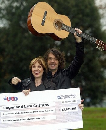UK Lotto Winners Roger and Lara Griffiths With Oversized Cheque